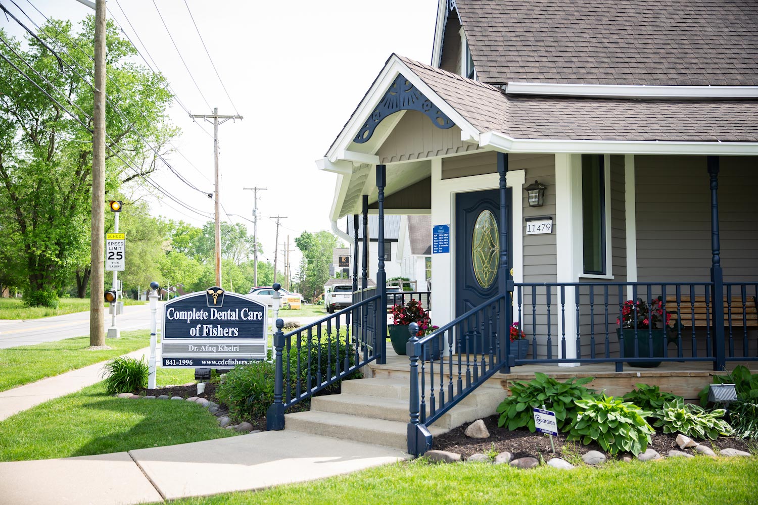 The image shows a small building with a sign that reads Danville City Hall next to a sidewalk, with a ramp leading up to an entrance door.